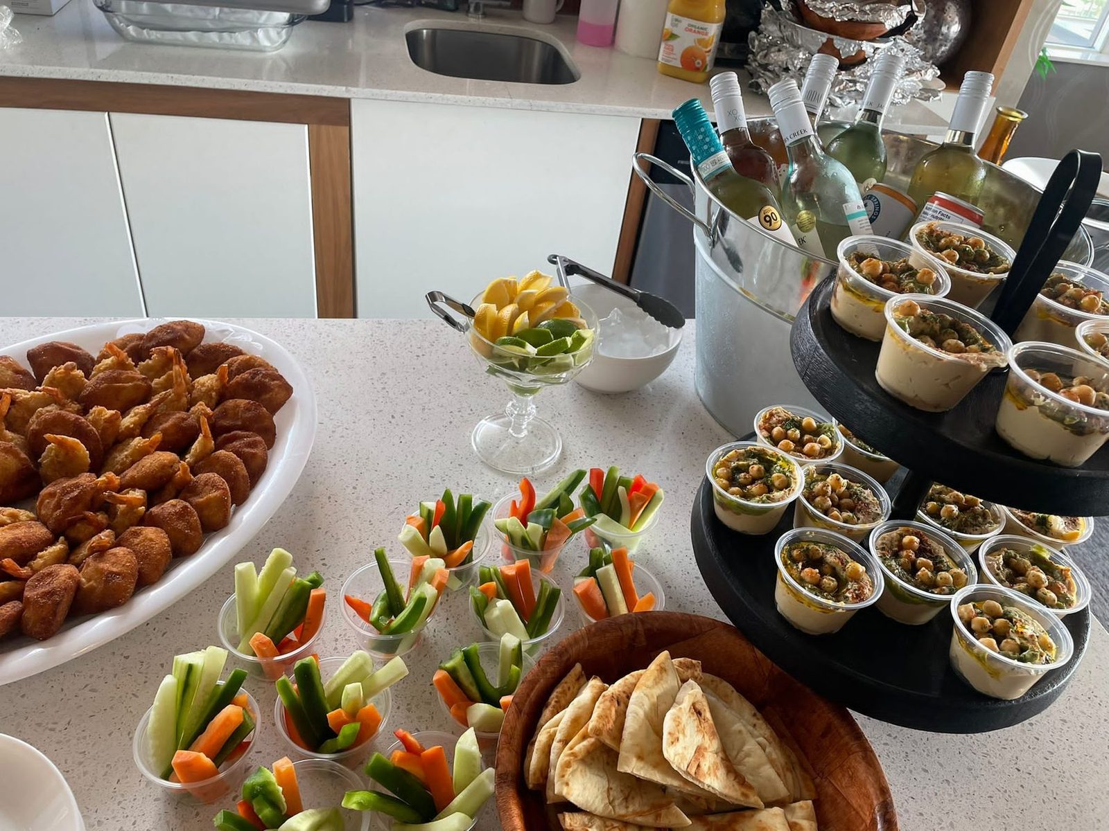 A catered buffet of Gujarati starters, chaat cups and sides
