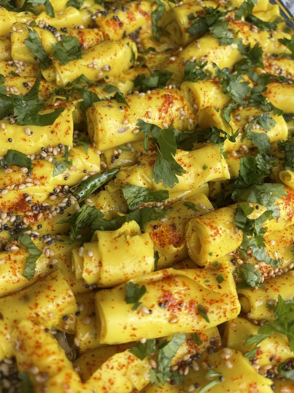 Khandvi rolls, tempered and garnished