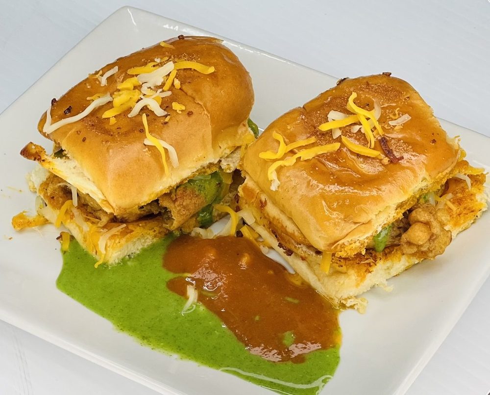 Vada pav plated with fresh chutneys