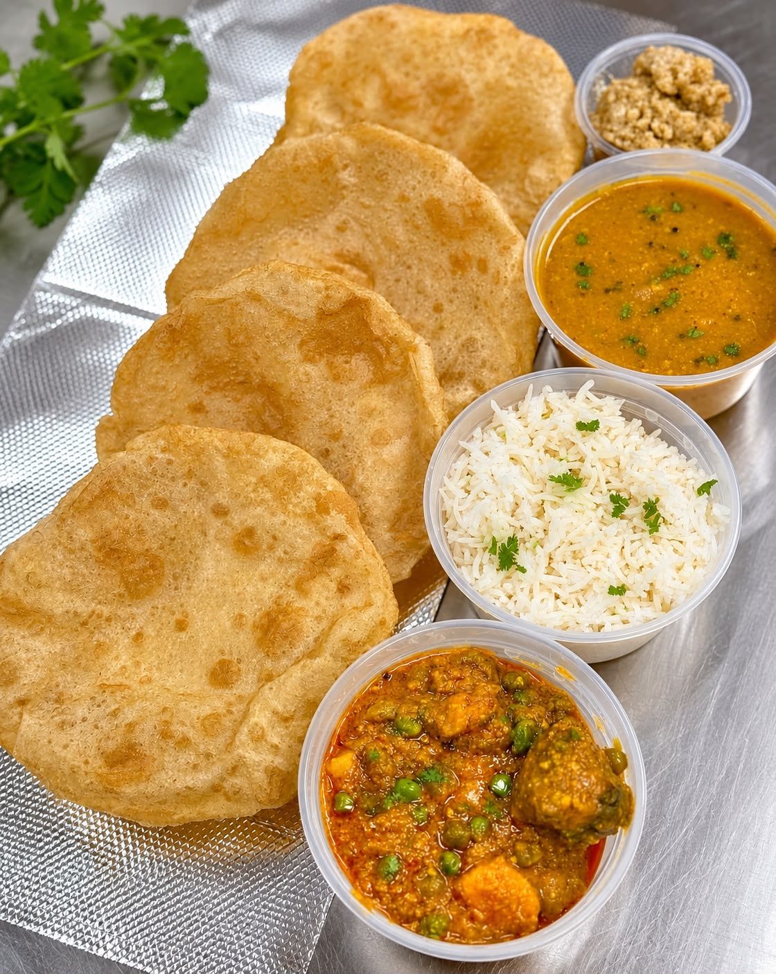 A Tiffin Box Barrie thali: rotli, shaak, dal, jeera rice and chaas