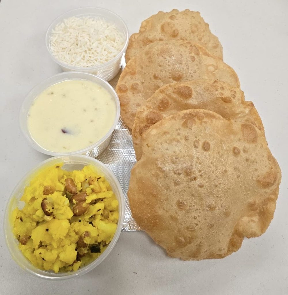 Puri, shrikhand, bataka nu shaak and rice