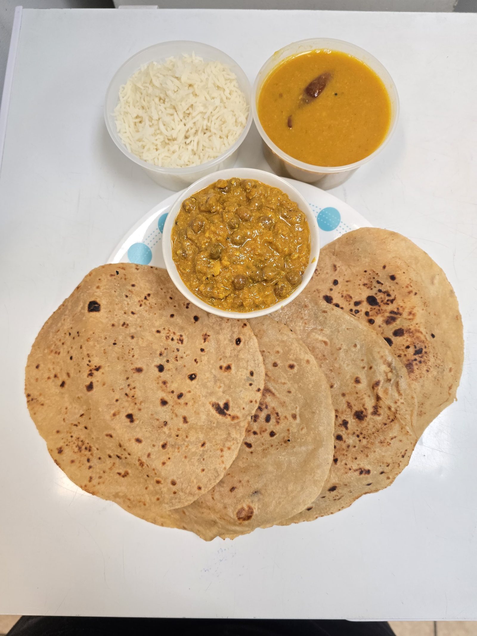 A Tiffin Box Barrie tiffin: roti, dal, rice and sabji in takeaway containers