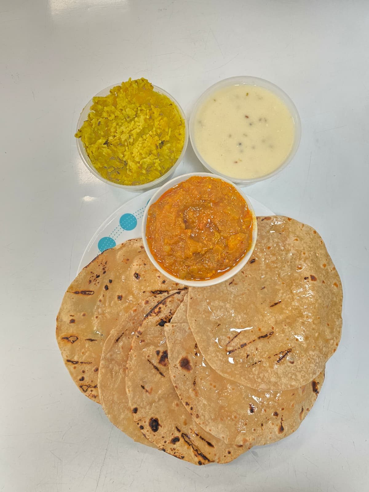 8oz tiffin — roti, dal, rice and sabji